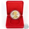 Image 1 : RCM Issue: 2004 $1 1oz Gilded American Eagle Fine Silver Coin (TAX Exempt). Coin is lightly toned an
