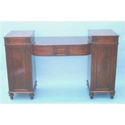 A Regency mahogany pedestal sideboard by Gillows of Lancaster, the D-shaped centre section fitted...