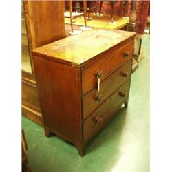 Early 19c mahogany bachelor chest of drawers on splay feet and shaped apron with fold over top…