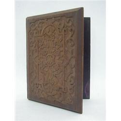 A CARVED OAK DESK BLOTTER, late 19th Century, Morocco lined, 35cm x 26cm (closed) and a hardwood...
