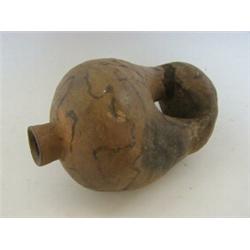 A TRIBAL POT, humanoid shape, unglazed clay, height 20cm  20-30...