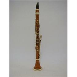 A BOXWOOD CLARINET, Percival Woods Patent, ivory and bone trim, makers' mark impressed, length 48...