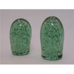 A NEAR PAIR OF GREEN GLASS DUMPY PAPERWEIGHTS, bubble inclusions, pontil bases, height 14cm (2)...