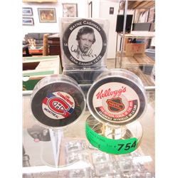 4 Hockey pucks - 2 Autographed