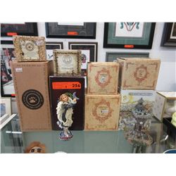 8 Collectible figurines in original boxes