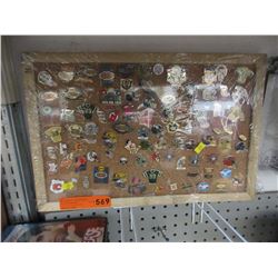 Collectible sport team pins on cork board