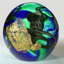 Clear-encased abstract design paperweight