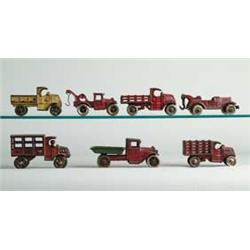LOT OF 7 SMALL C.I. TRUCKS