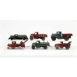 LOT OF 6 SMALL C.I. TRUCKS