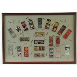 COLLECTION OF MOUNTED ADVERTISING MATCH COVERS