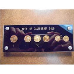 6 PIECE TYPE SET OF CALIFORNIA GOLD 2-1/4 DOLLARS, 3- 1/2 DOLLARS AND 1-$1. IN NICE PLASTIC CASE, RE