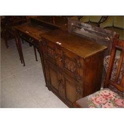 SMALL OAK 4 DOOR CUPBOARD Estimate: £100-150...