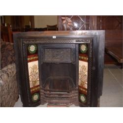 VICTORIAN CAST IRON FIREPLACE WITH FLORAL PATTERNED TILES Estimate: £100-150...