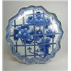 Image 1 : An 18th century Japanese Arita dish painted in blue with a trellis of peonies within a raised petal.