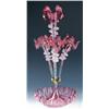 Image 1 : A Victorian cranberry glass epergne, the central and three flanking trumpet vases with frilled wavy.