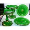 Image 1 : A 19th century Bohemian green glass dessert service, each piece gilt with central rosette within ke.