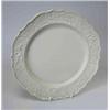 Image 1 : A mid 18th century saltglaze plate, the rim moulded with a cavalryman, an eagle and trophies on bas.