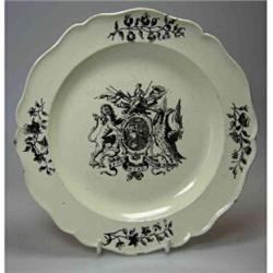 A late 18th century creamware plate printed in black with a stylised armorial of St George lancing..