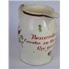 Image 1 : A late 18th century creamware jug, the bellied cylindrical shape painted with flowers below the red.