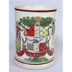 A late 18th century creamware mug printed in black and overpainted with a pseudo armorial supported.