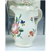 Image 1 : A late 18th century creamware jug, possibly Leeds, the baluster shape painted with coloured flowers.
