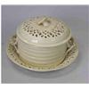Image 1 : An early 19th century creamware covered bowl and stand, the pierced domed lid with flower finial, t.