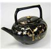 Image 1 : A Wedgwood Jackfield glazed teapot and cover, date letter for 1876, the globular shape of quatrefoil