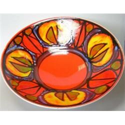 A 20th century Poole bowl painted in an abstract pattern of four yellow roundels defined in black a.