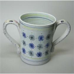 A 20th century Rye Potteries loving cup, the slightly tapering cylindrical vessel painted with star.