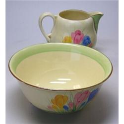 A mid 20th century Clarice Cliff jug and bowl painted with the 'Spring' pattern of crocuses within..