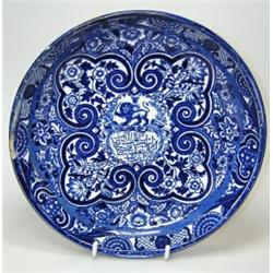 A mid Victorian blue and white armorial plate printed with a crowned head on the back of a sword wi.