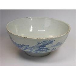 A mid 18th century Delft blue and white bowl painted with Chinese islands, that on the exterior wit.