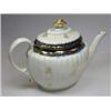 Image 1 : An early 19th century Worcester teapot and cover, the gadrooned oval shape gilt with scattered bunc.