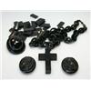 Image 1 : A box of jet jewellery including: a nautical link necklace with pendant cross, an oval locket brooc.