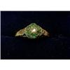 Image 1 : A Victorian scroll carved ring set with an emerald and diamond cluster  £180-220...