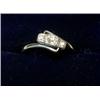 Image 1 : A three stone diamond crossover ring   £140-180...