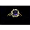 Image 1 : An oval ring with sapphire within a surround of rosecut diamonds  £100-150...