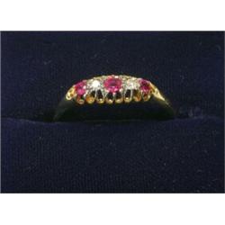 An 18ct gold five stone ring set with rubies and diamonds   £80-120...