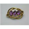 Image 1 : A 19th century knot brooch set with three amethyst coloured stones   £30-50...