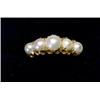 Image 1 : A ring set with five graduated pearls   £50-70...