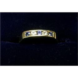 A 9ct gold five stone ring set with sapphires and diamonds  £90-120...