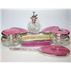 Image 1 : A silver mounted dressing table set by Mappin & Webb, London 1934, pink bassetaille enamel decorate.