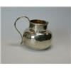 Image 1 : A silver milk jug by George Perkins, London 1919, of plain compressed circular shape below a cylind.
