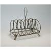 Image 1 : A George III silver toast rack by Peter, Ann and William Bateman, London 1802, the seven plain round