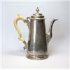 Image 1 : A George II silver coffee pot by Gabriel Sleath, London 1742, of tapering baluster form raised from.