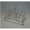 Image 1 : George III seven bar toast rack by Soloman Hougham, London 1803, standing on an arched flat reeded w