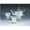 Image 1 : A silver three piece tea set by the Adie Brothers, Birmingham 1933, comprising: a teapot of tapering