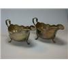 Image 1 : A pair of silver sauce boats, maker FC, Sheffield 1943, each of plain oval shape with wavy moulded..