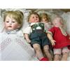 Image 1 : A collection of four various dolls, to include: a Heubach bisque headed boy doll with painted eyes..