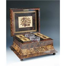 A mid 19th century Tunbridge ware double tea caddy, the waisted rectangular sides and raised panel..